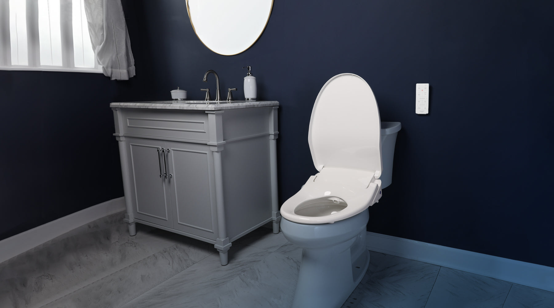 BB-1200 bidet seat installed on a toilet in a navy bathroom. Everything but the seat has a blue tint.