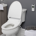 Bliss BB-2000 Bidet Seat Bidet lifestyle on toilet seat open with remote mounted on wall in clean modern bathroom